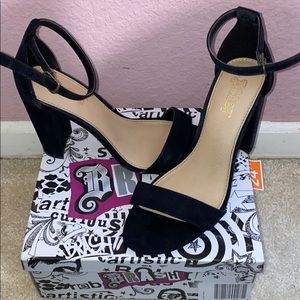 Black High Heels, 3-4” heel w/ adjustable strap.